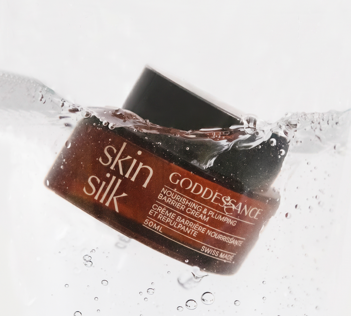 Skin Silk jar splashing into water