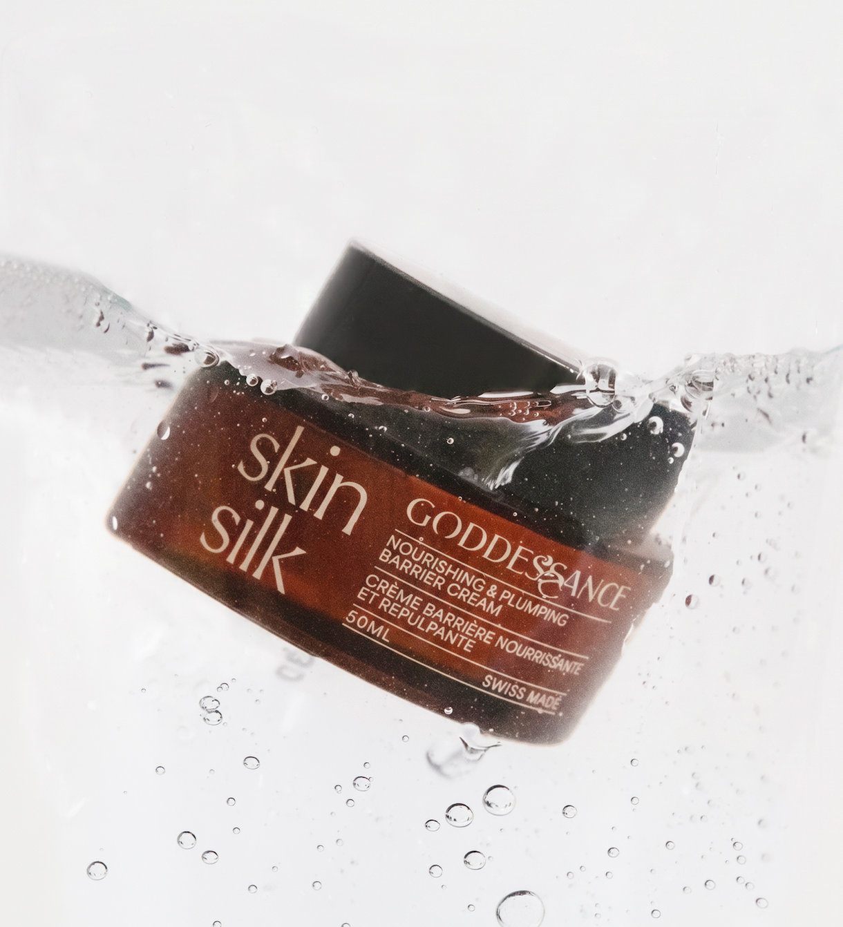 Skin Silk jar splashing into water