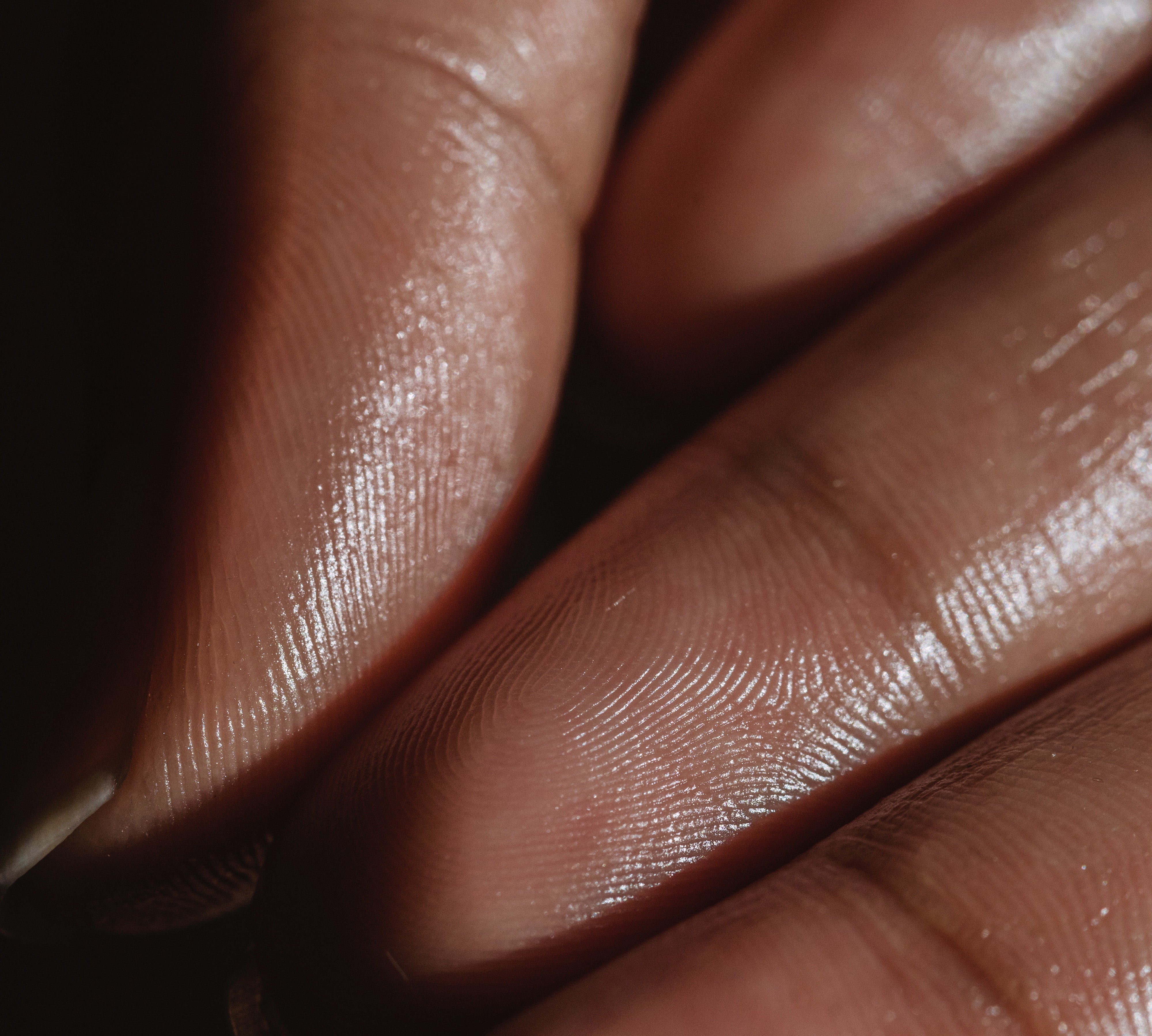 Close-up of fingertips and skin