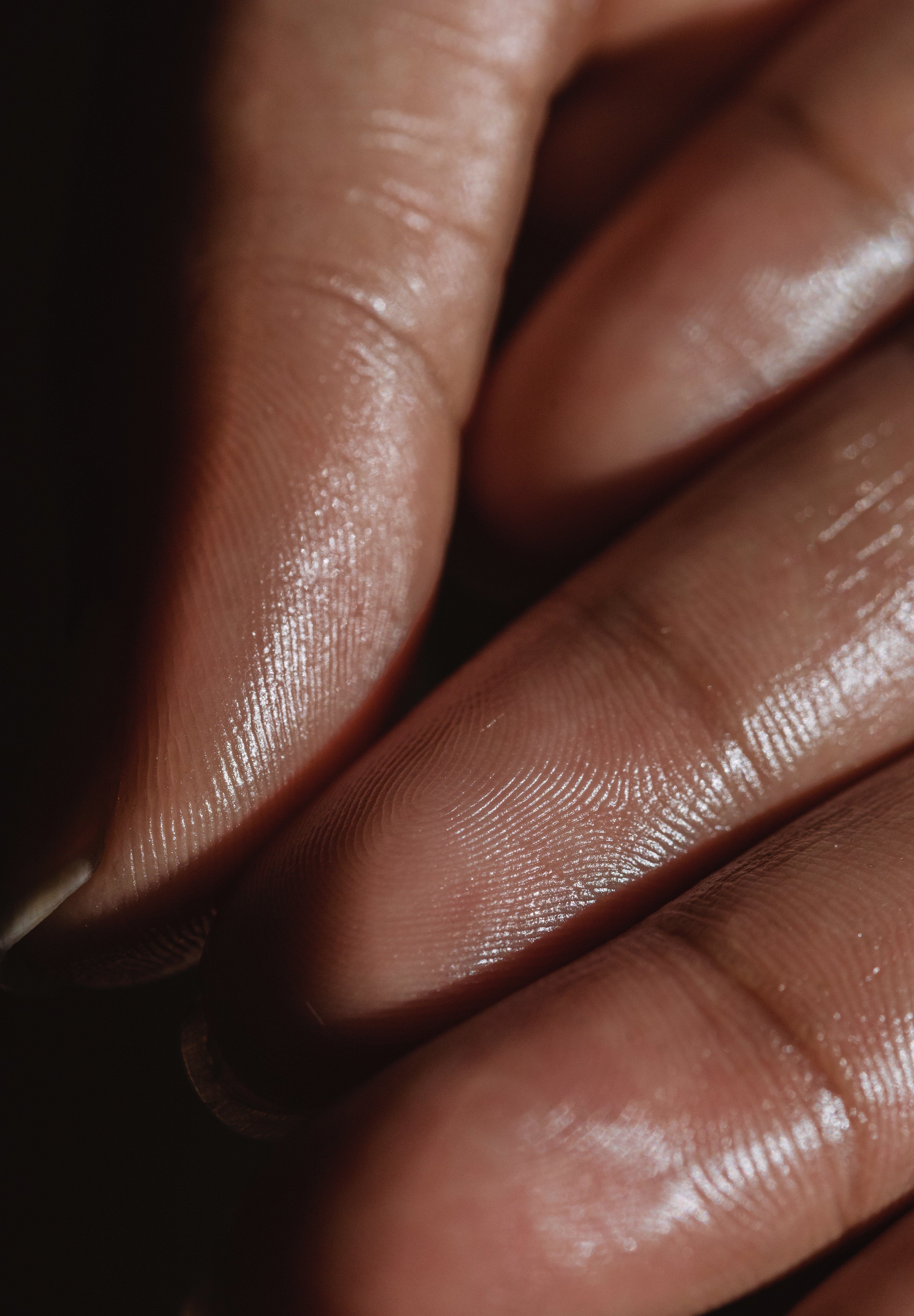 Close-up of fingertips and skin